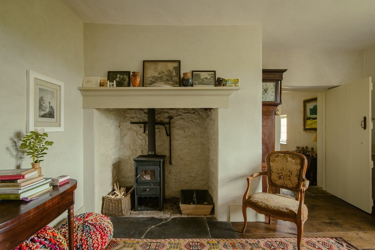 A Yellow Farmhouse with Bold Color Pops in Wales 7 sitting room with woodburner