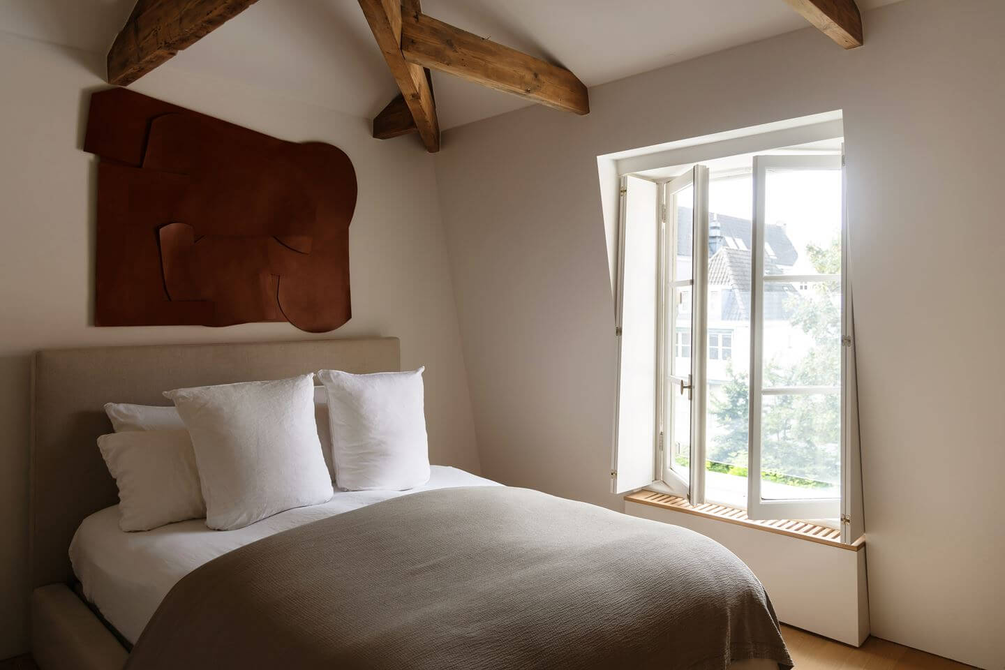 An Apartment with High Pitched Ceilings in an Amsterdam Canal House 14 small bedroom with wooden beams