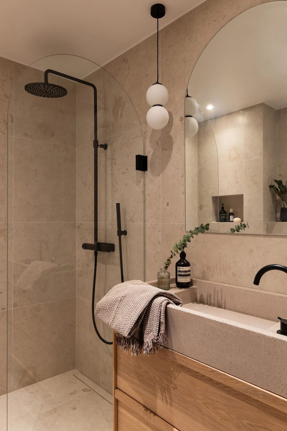 A Renovated Stockholm Apartment with Subtle Color Details 25 small modern bathroom with black fittings nordroom