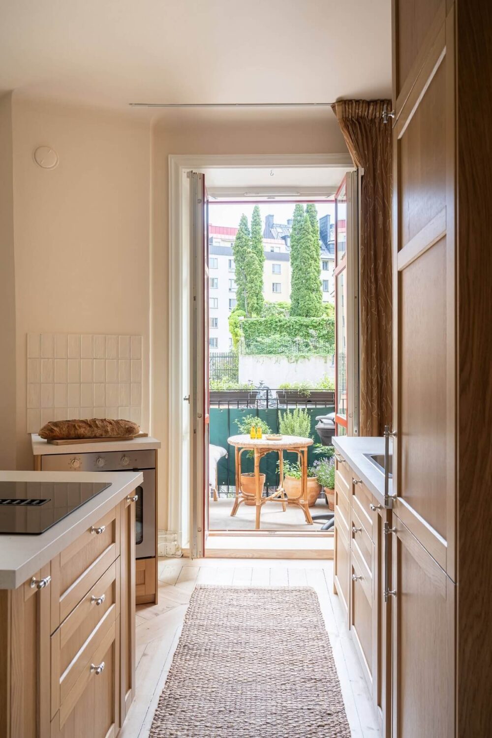 An Elegant Small Renovated Apartment in Stockholm 9 small oak kitchen balcony