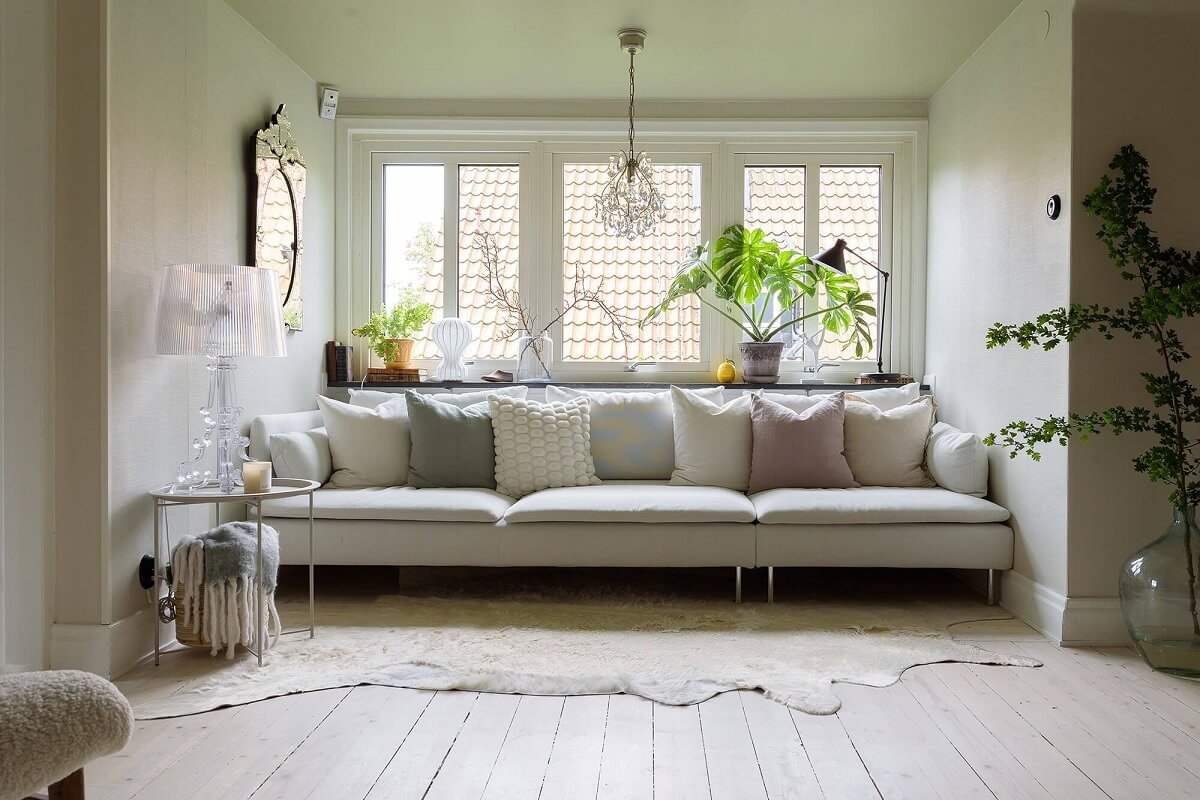 A Beautiful Family Home in a Grand 1930s Villa in Sweden 14 sofa in front of window