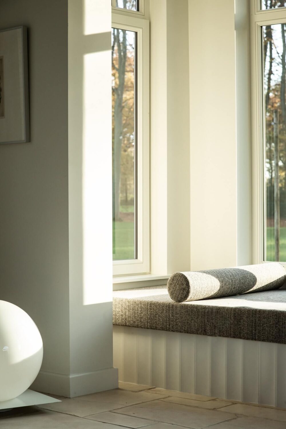 Historic Character and Timeless Elegant Interiors in a Restored Belgian Villa 5 sunny window seat detail