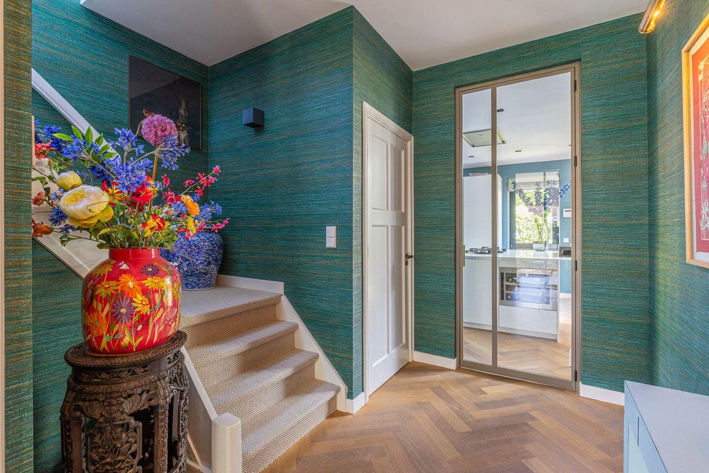Bold Color Accents in a Dutch Family Home 10 teal green wallpaper hallway