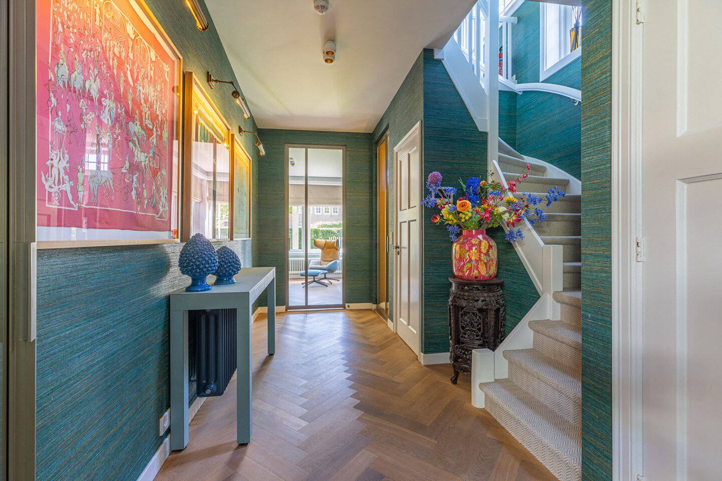Bold Color Accents in a Dutch Family Home 11 teal wallpapered hallway