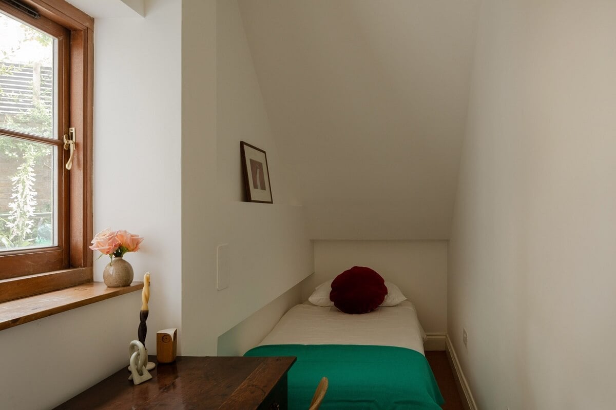 Pared Back Interiors and Light-Filled Spaces in a London Apartment 12 tiny bedroom with slanted ceiling