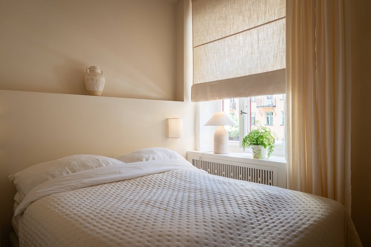 An Elegant Small Renovated Apartment in Stockholm 16 tiny beige bedroom with ledge