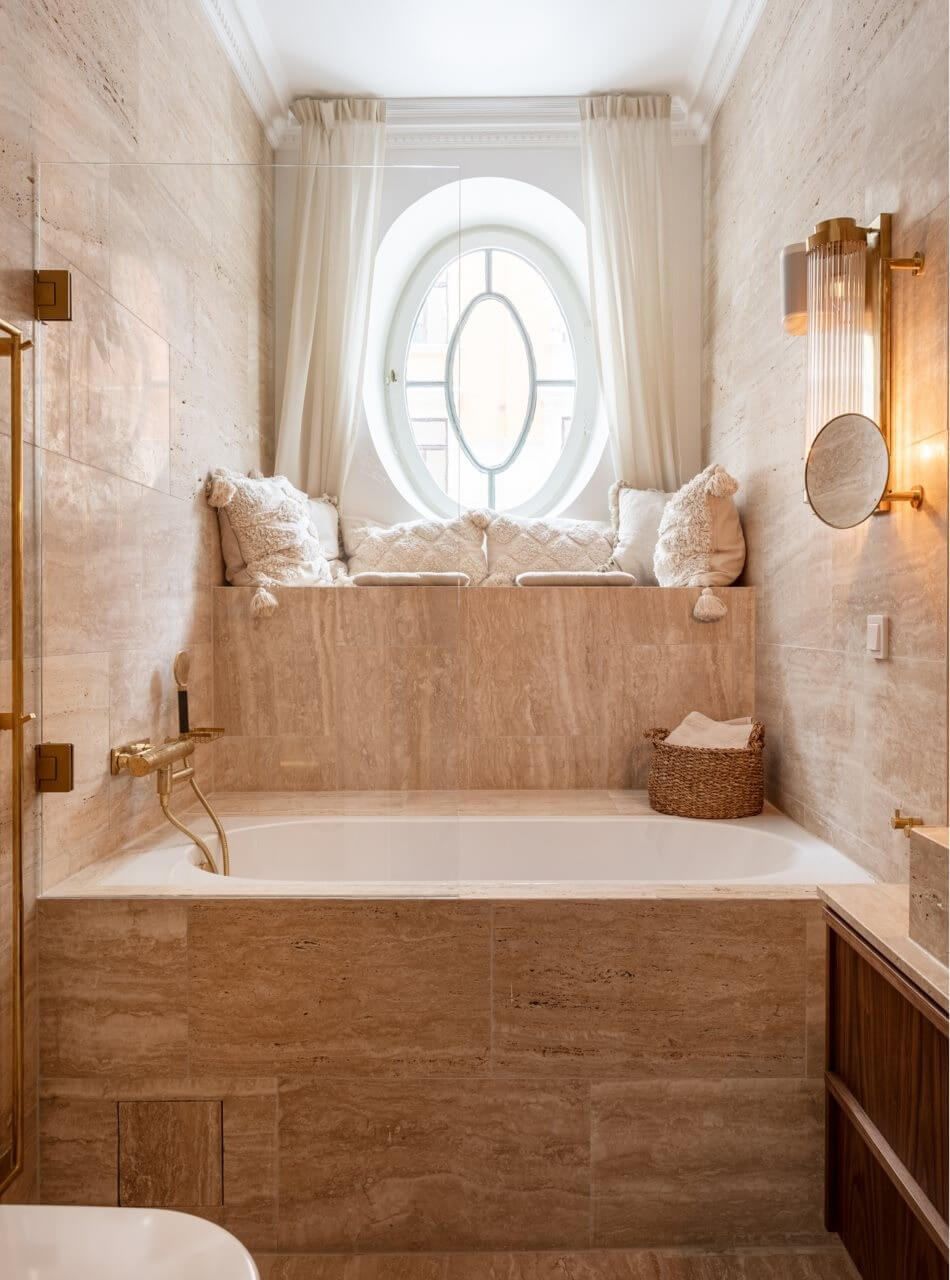 A Luxurious Stockholm Apartment with Period Features 26 travertine bathroom with bath and window seat