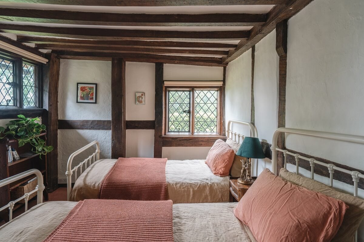 Magnificent Period Features in an English Tudor House 20 twin bedroom with exposed beams