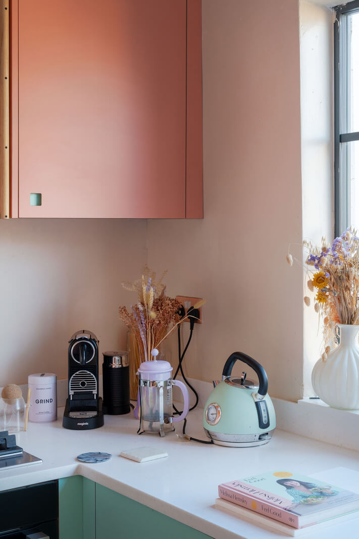 A London Apartment with a Turquoise and Pink Kitchen 3 two tone kitchen cabinets nordroom