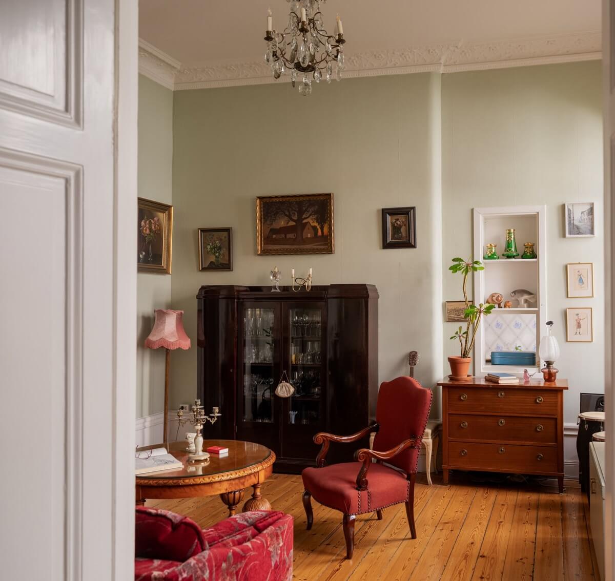 Antique Furniture and Arched Windows in a Stockholm Apartment 7 vintage living room with wooden floor