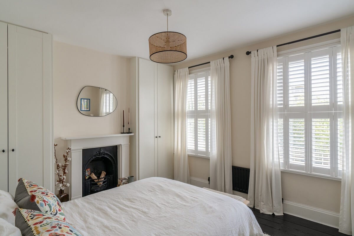 Blue Tones in a Two-Bedroom Victorian Cottage 10 white bedroom fireplace wardrobes
