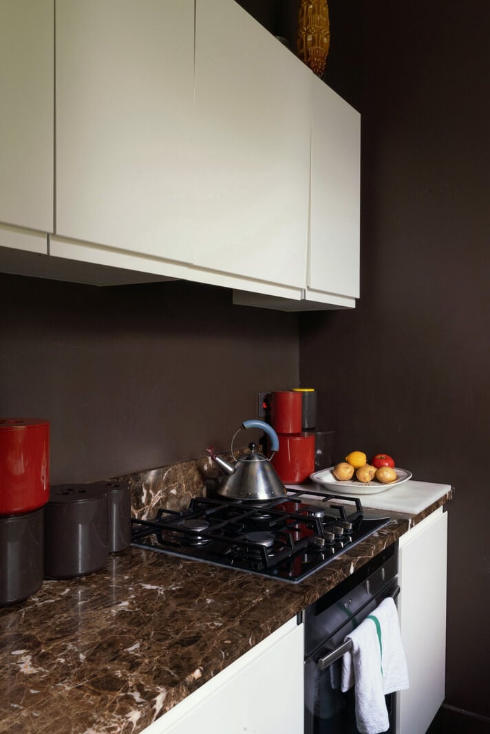 A Moody Color Palette and Eclectic Interiors in a London Apartment 9 white kitchen cabinets with marble worktop nordroom