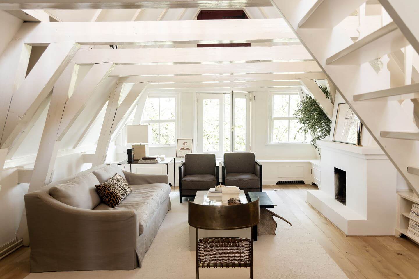 An Apartment with High Pitched Ceilings in an Amsterdam Canal House 1 white living room pitched ceiling wooden beams amsterdam apartment nordroom