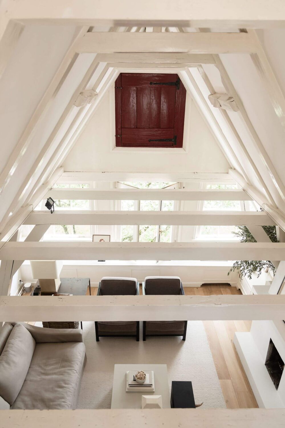 An Apartment with High Pitched Ceilings in an Amsterdam Canal House 9 white painted beams pitched ceiling