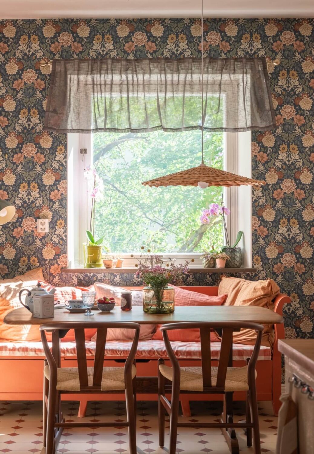 Floral Wallpaper and a Pink Kitchen in a Midcentury Apartment 11 wicker pendant light and bench floral wallpaper nordroom
