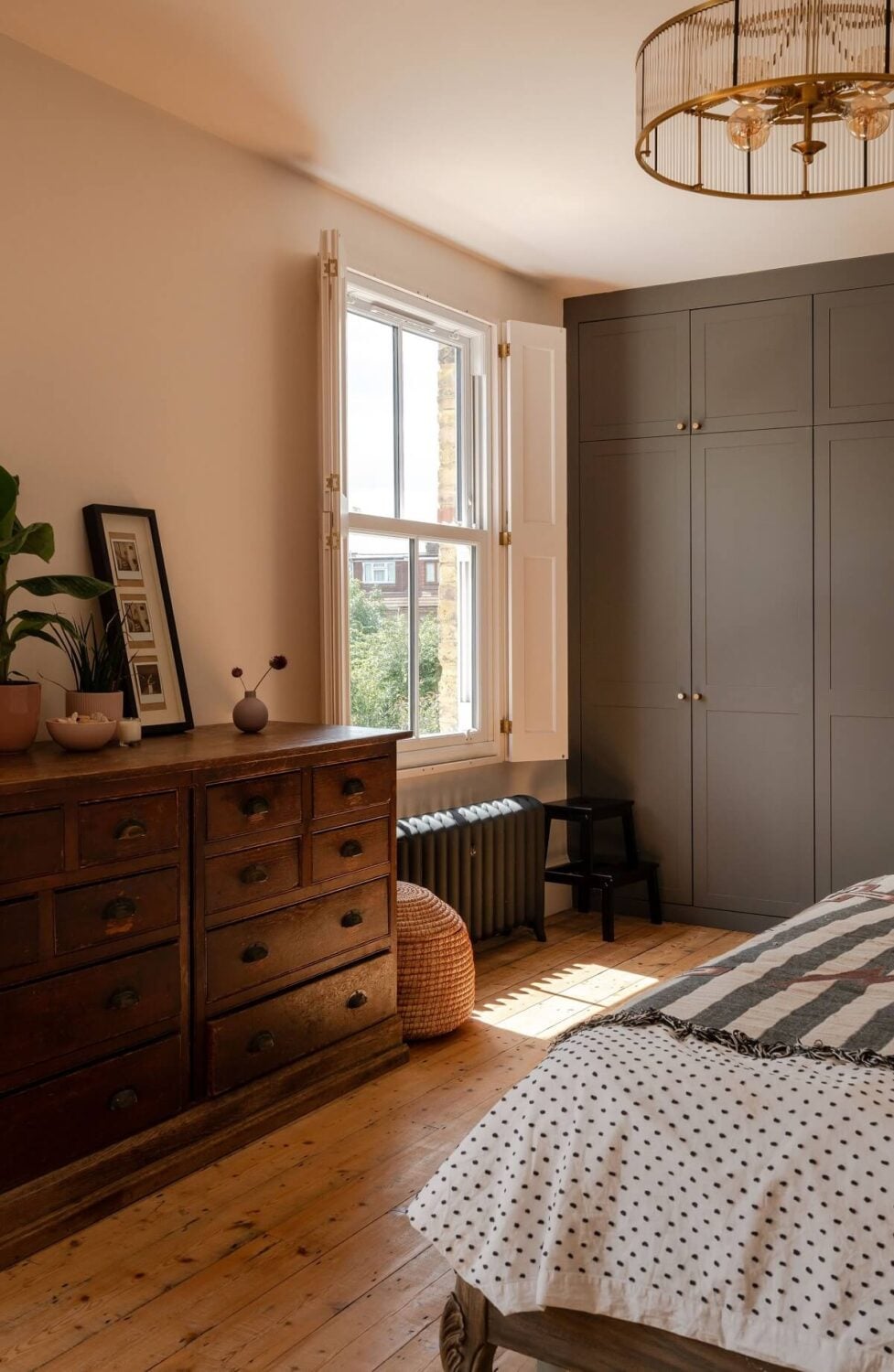 A Stunning Color Palette in an Extended Edwardian House in London 20 window shutters and built in wardrobes in bedroom nordroom