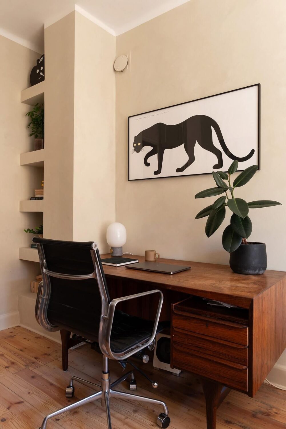 A Renovated Stockholm Apartment with Subtle Color Details 17 wooden desk and built in bookshelves