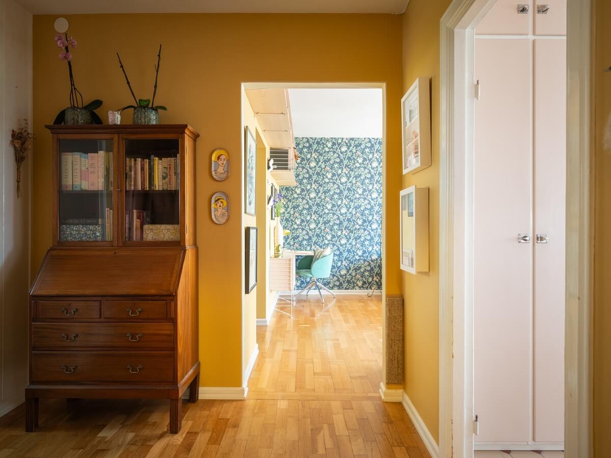 Floral Wallpaper and a Pink Kitchen in a Midcentury Apartment 8 yellow hallway