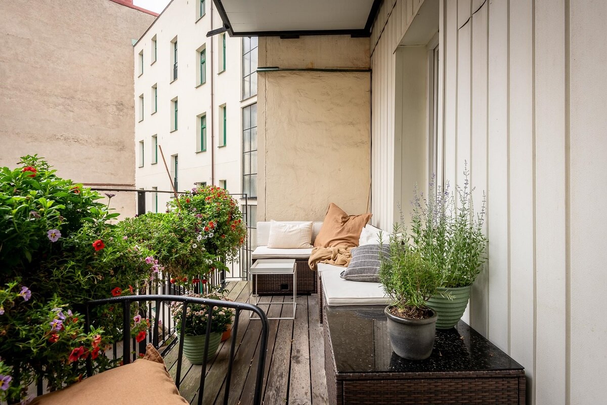 A Spacious Renovated Apartment with a Light Pink Living Room 21 balcony with corner seating