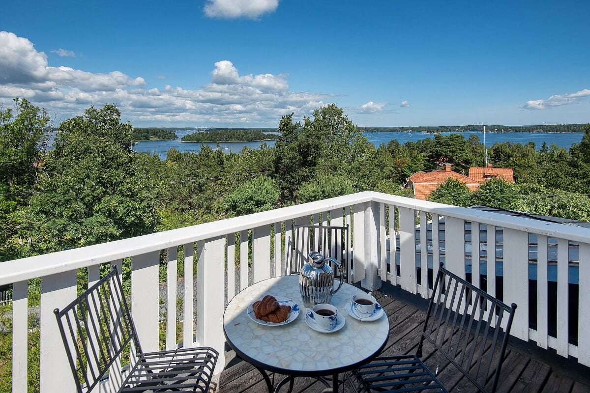 A Yellow Swedish Villa with Views of the Sea 14 balcony with sea view