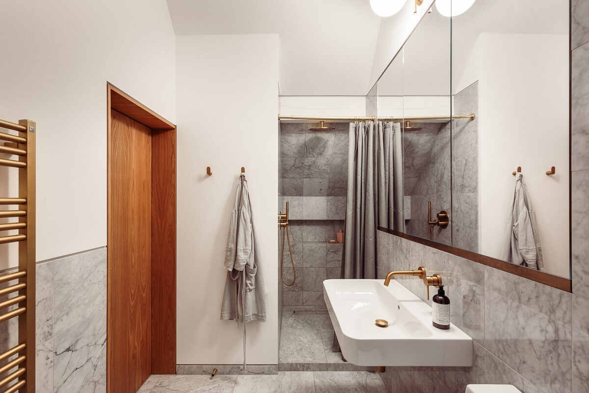 A London Duplex Apartment with a Purple Kitchen 16 bathroom marble tiles wooden door