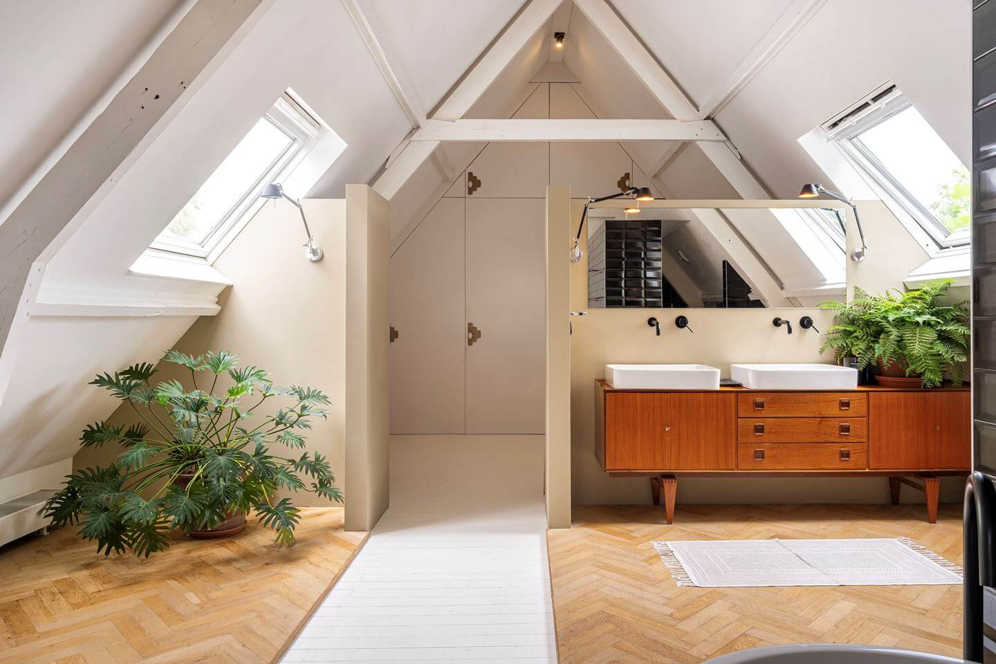 An Old Smokehouse Transformed Into a Modern Industrial Home 22 bathroom sloped ceiling