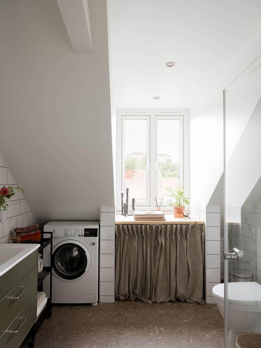 A Beautiful Renovated Maisonette Home with a Calm Color Palette 28 bathroom with washing machine