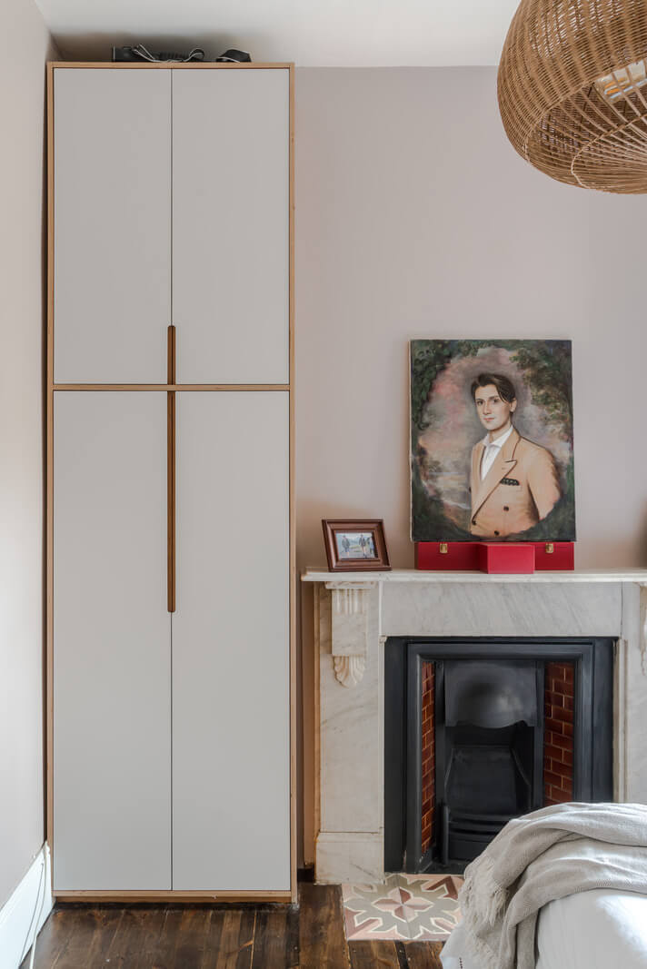A London Apartment with a Deep Olive Green Kitchen 13 bedroom fireplace and wardrobe