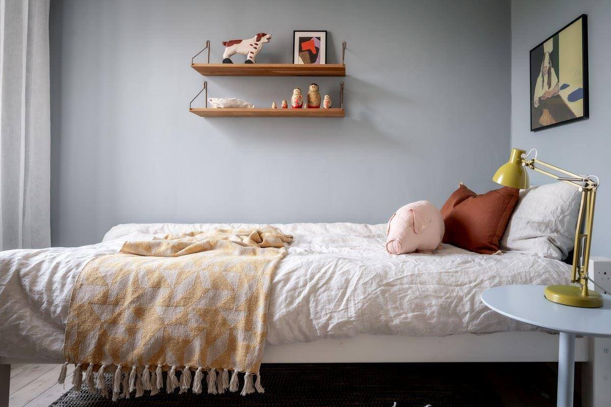 A Bright Swedish Apartment with Subtle Color Accents 22 bedroom with blue gray walls