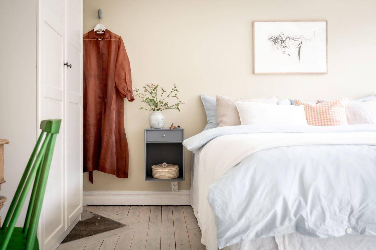 A Bright Swedish Apartment with Subtle Color Accents 17 bedroom with floating nightstand