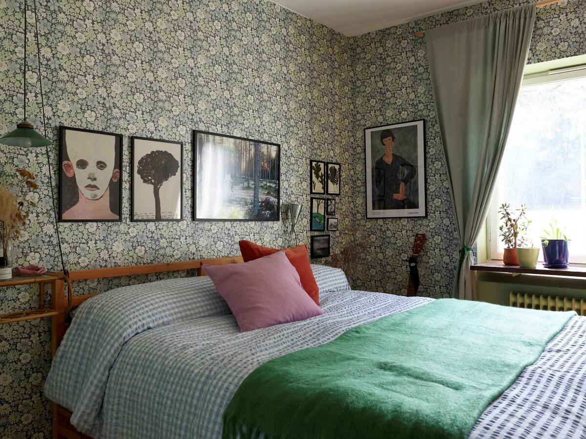 A Colorful Swedish Apartment Inspired by the 50s and 70s 23 bedroom with green wallpaper