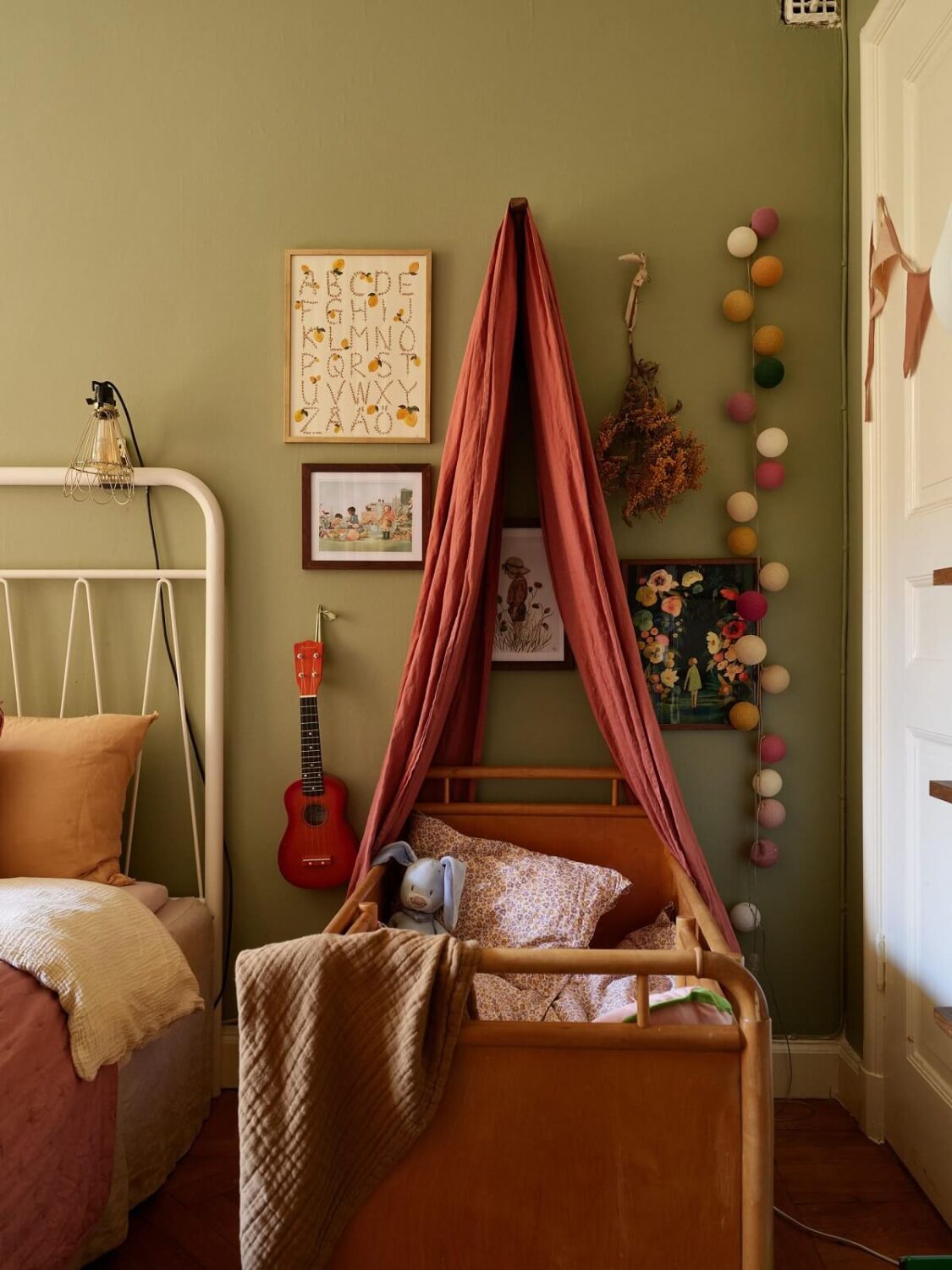 Best of 2024: Bedrooms 15 bedroom with green walls and baby cot with canopy nordroom
