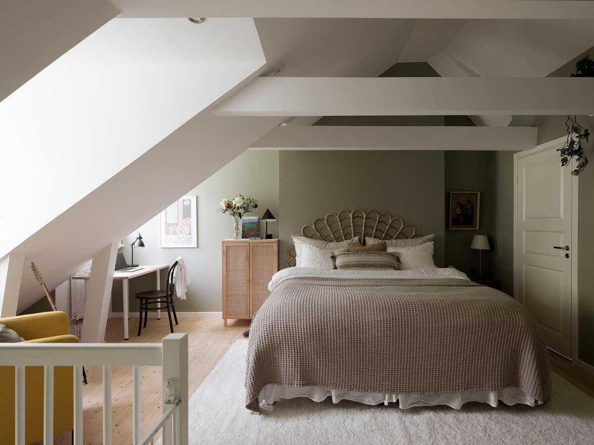 A Beautiful Renovated Maisonette Home with a Calm Color Palette 20 bedroom with slanted ceiling and exposed beams nordroom