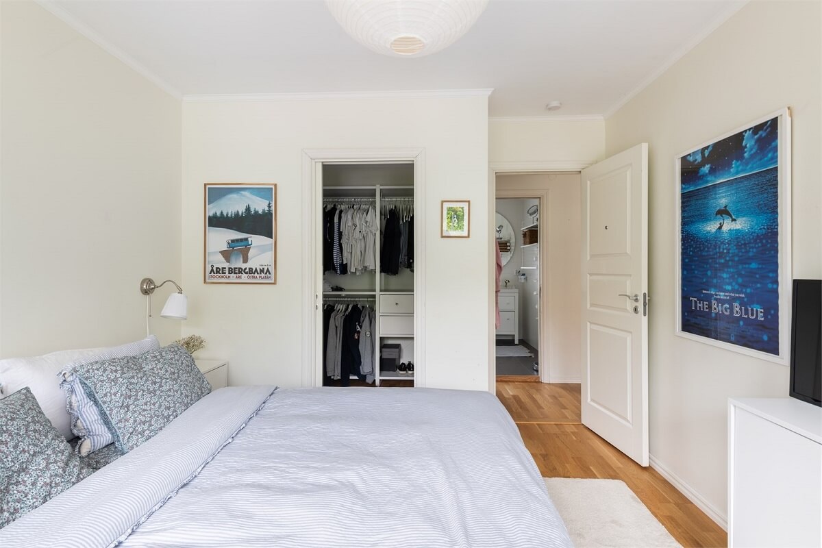 A Bright Open-Plan Swedish Home with a Pink Kitchen 23 bedroom with walk in closet