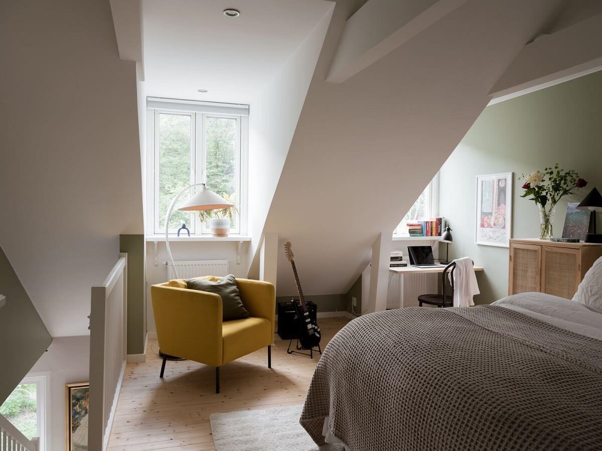 A Beautiful Renovated Maisonette Home with a Calm Color Palette 21 bedroom with yellow chair