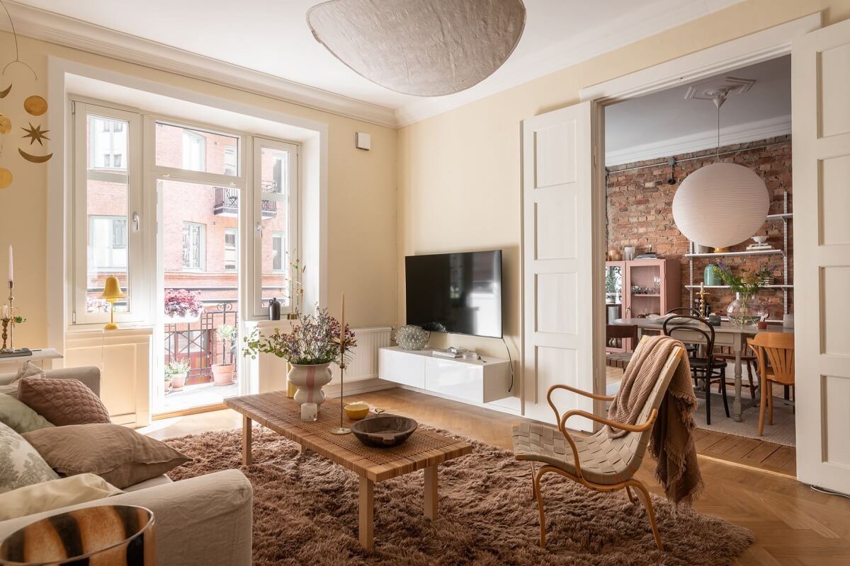 A Scandinavian Apartment with a Pale Yellow Living Room 3 beige living room with dining room attached