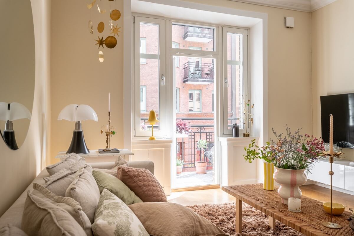 A Scandinavian Apartment with a Pale Yellow Living Room 4 beige living room with wallpaper
