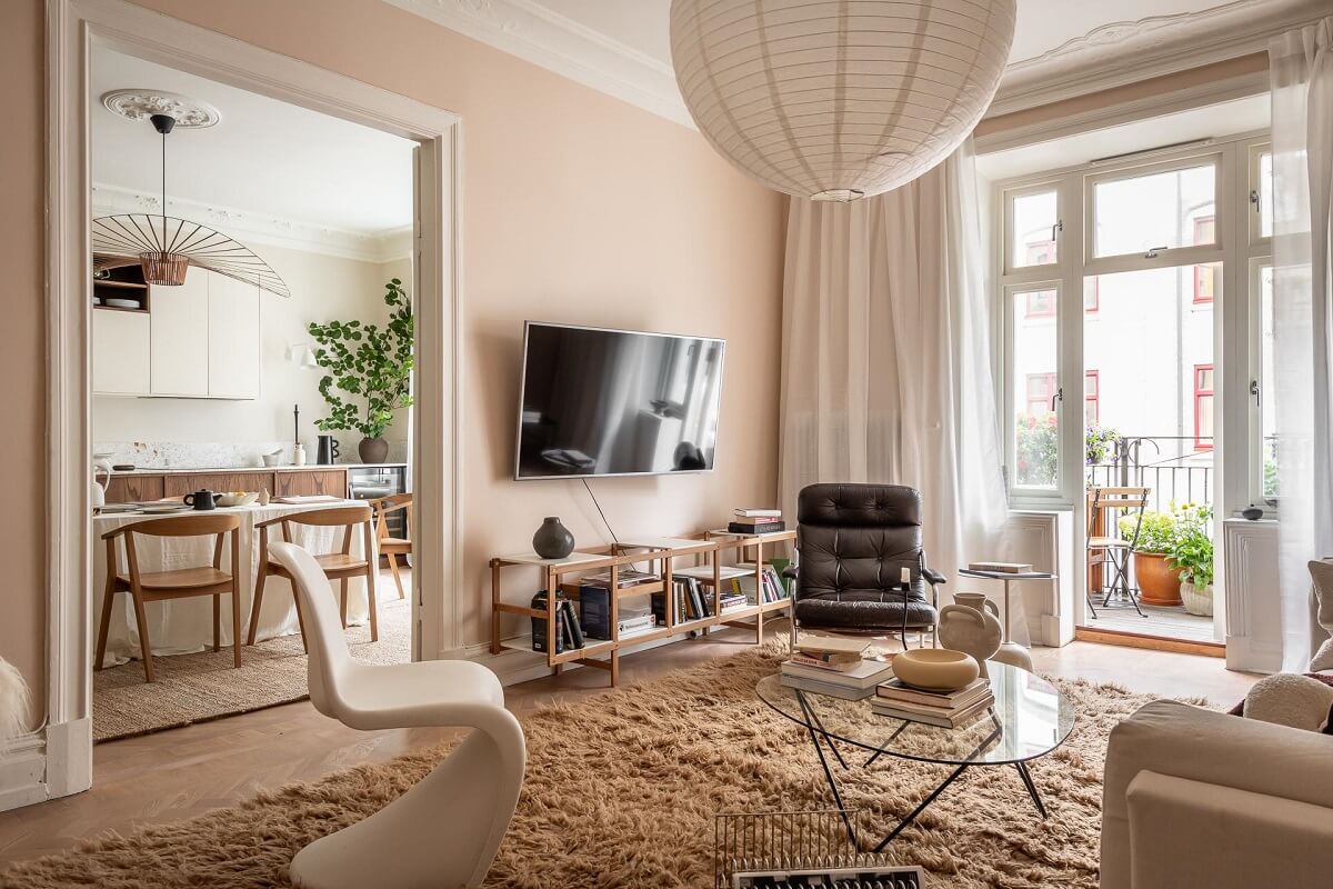 A Spacious Renovated Apartment with a Light Pink Living Room 6 beige pink living room with large rug
