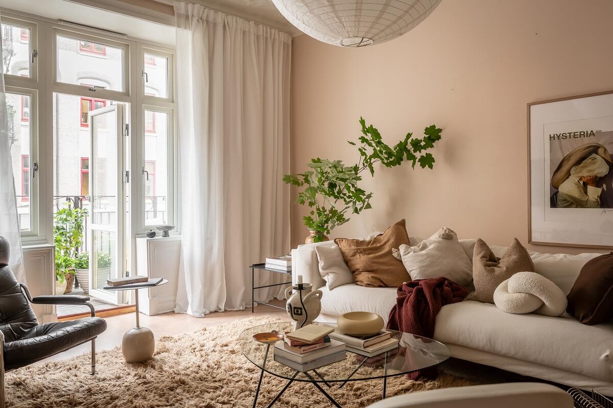A Spacious Renovated Apartment with a Light Pink Living Room 5 beige pink walls living room