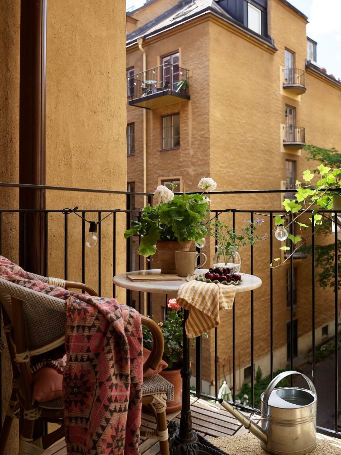 A Cozy 1920s Apartment with Original Details and Wallpaper 22 bistro table balcony