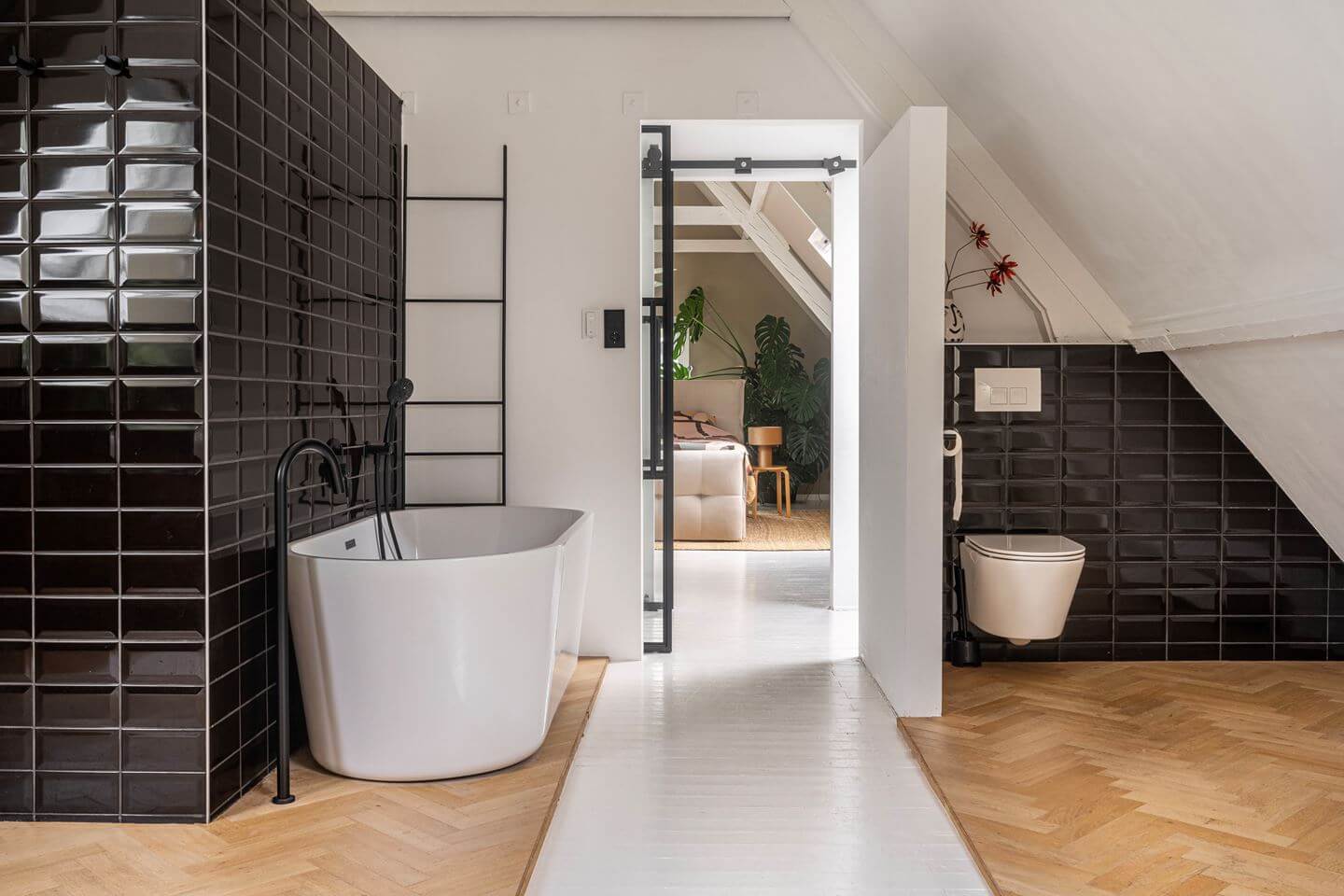 An Old Smokehouse Transformed Into a Modern Industrial Home 20 black bathroom tiles attic bathroom
