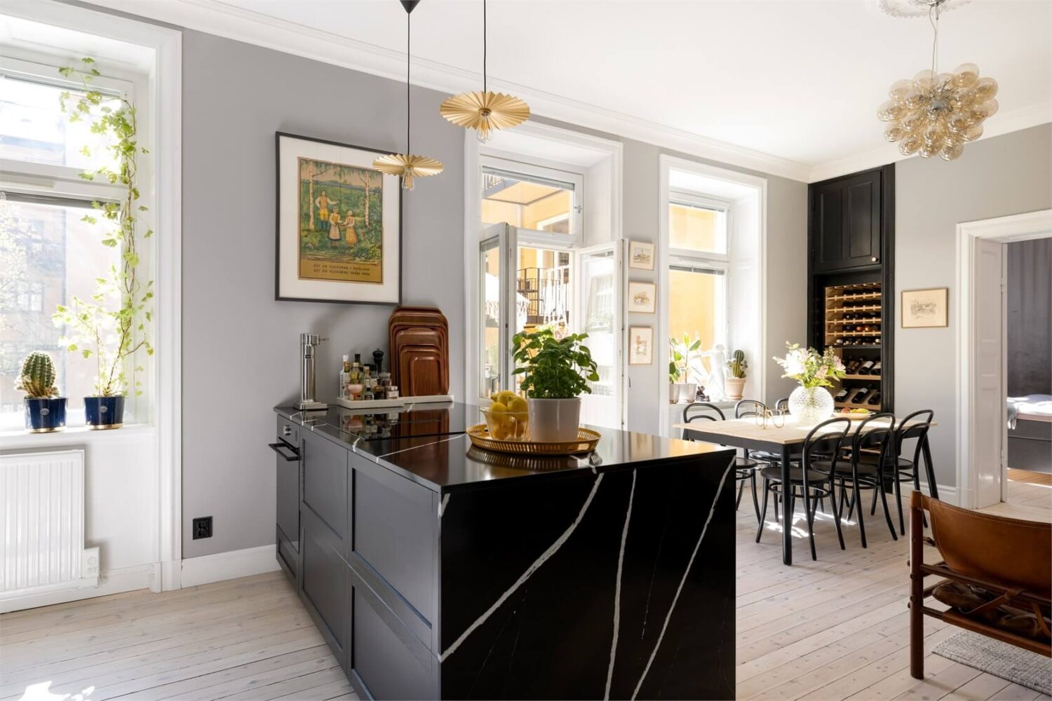 A Lovely Stockholm Apartment with a Black Kitchen and Pink Bedroom 7 black kitchen island