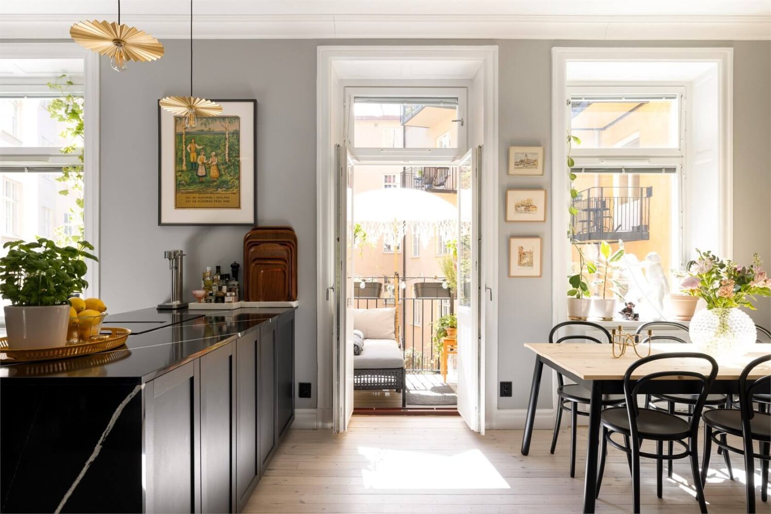 A Lovely Stockholm Apartment with a Black Kitchen and Pink Bedroom 8 black kitchen with balcony