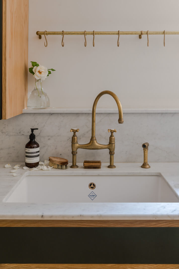 A London Apartment with a Deep Olive Green Kitchen 6 brass kitchen fittings