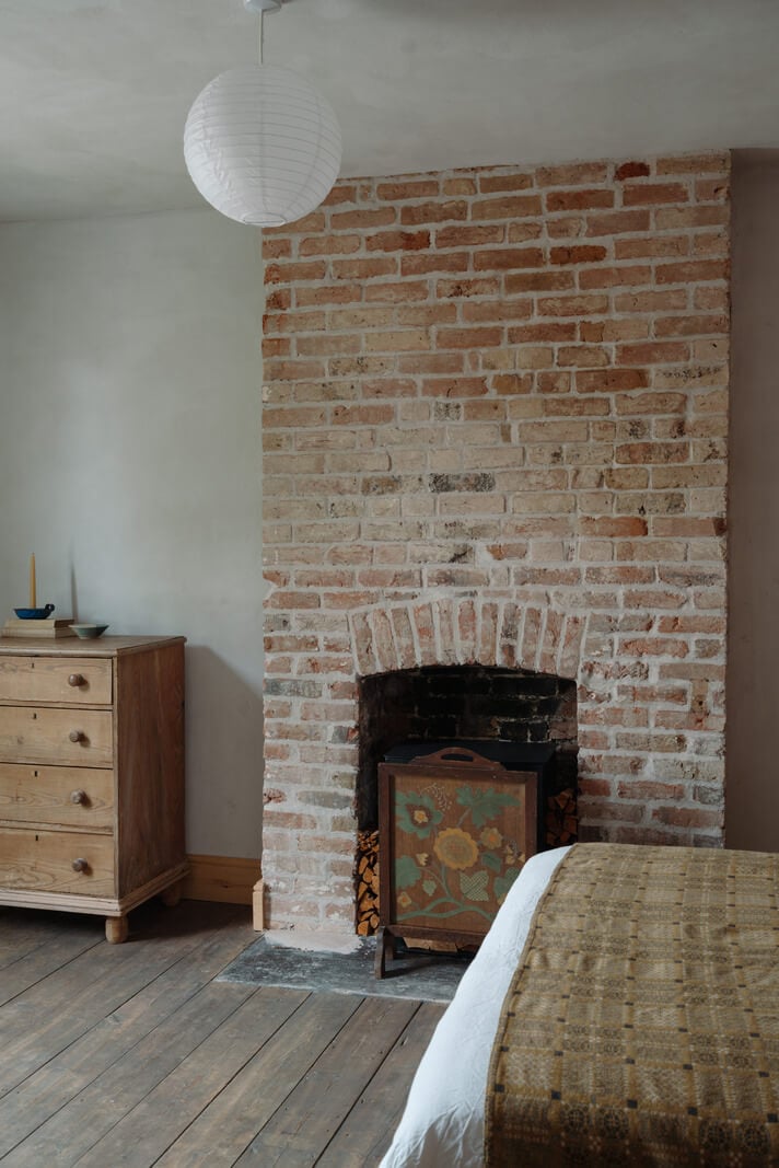 Pared Back Interiors in an English Home in Kent 22 brick fireplace