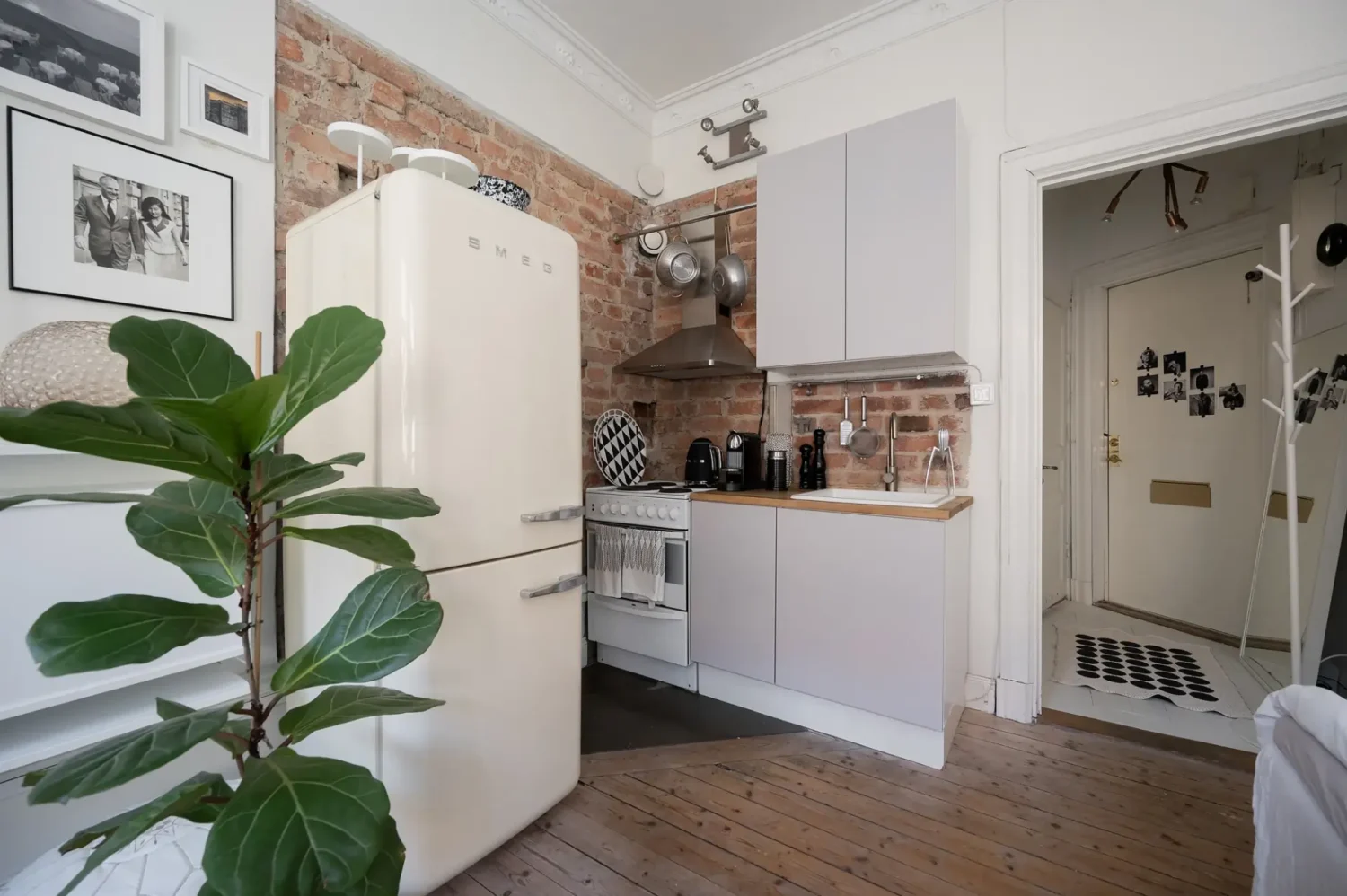 A Small Bright Scandinavian Studio Apartment 9 brick wall studio apartment kitchen