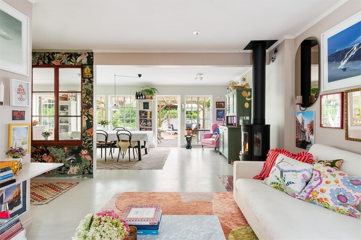 A Bright Open-Plan Swedish Home with a Pink Kitchen 5 bright open plan living space with wood burner