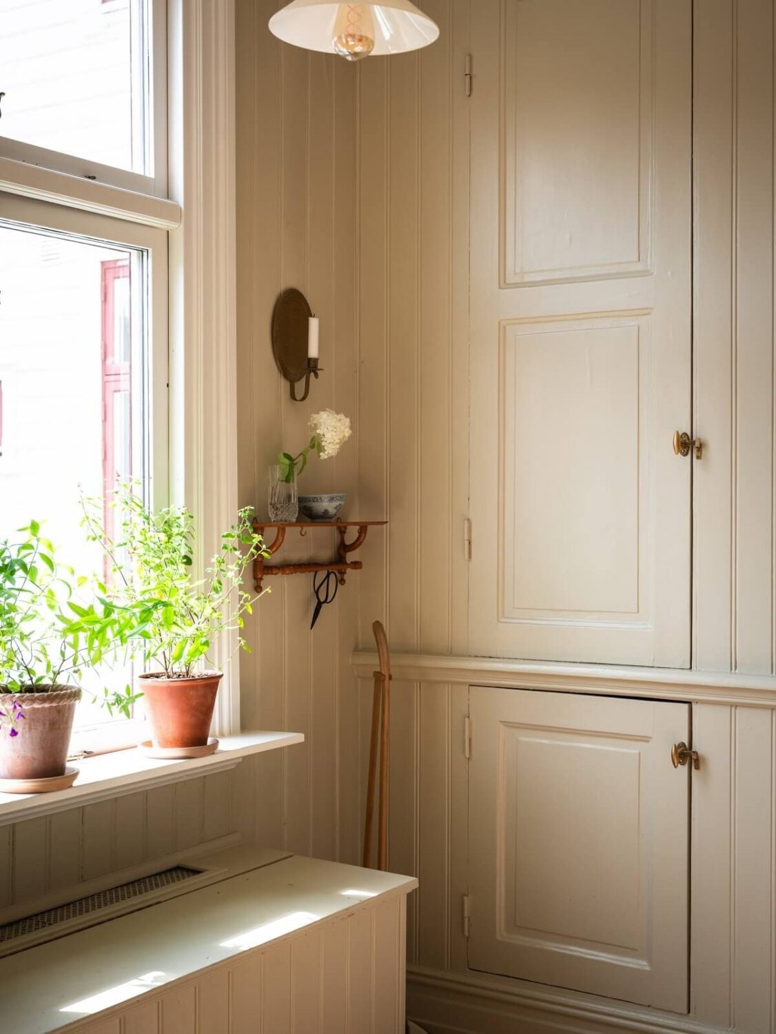Charming Vintage Country Style in a Family Apartment in Sweden 12 built in kitchen cabinet