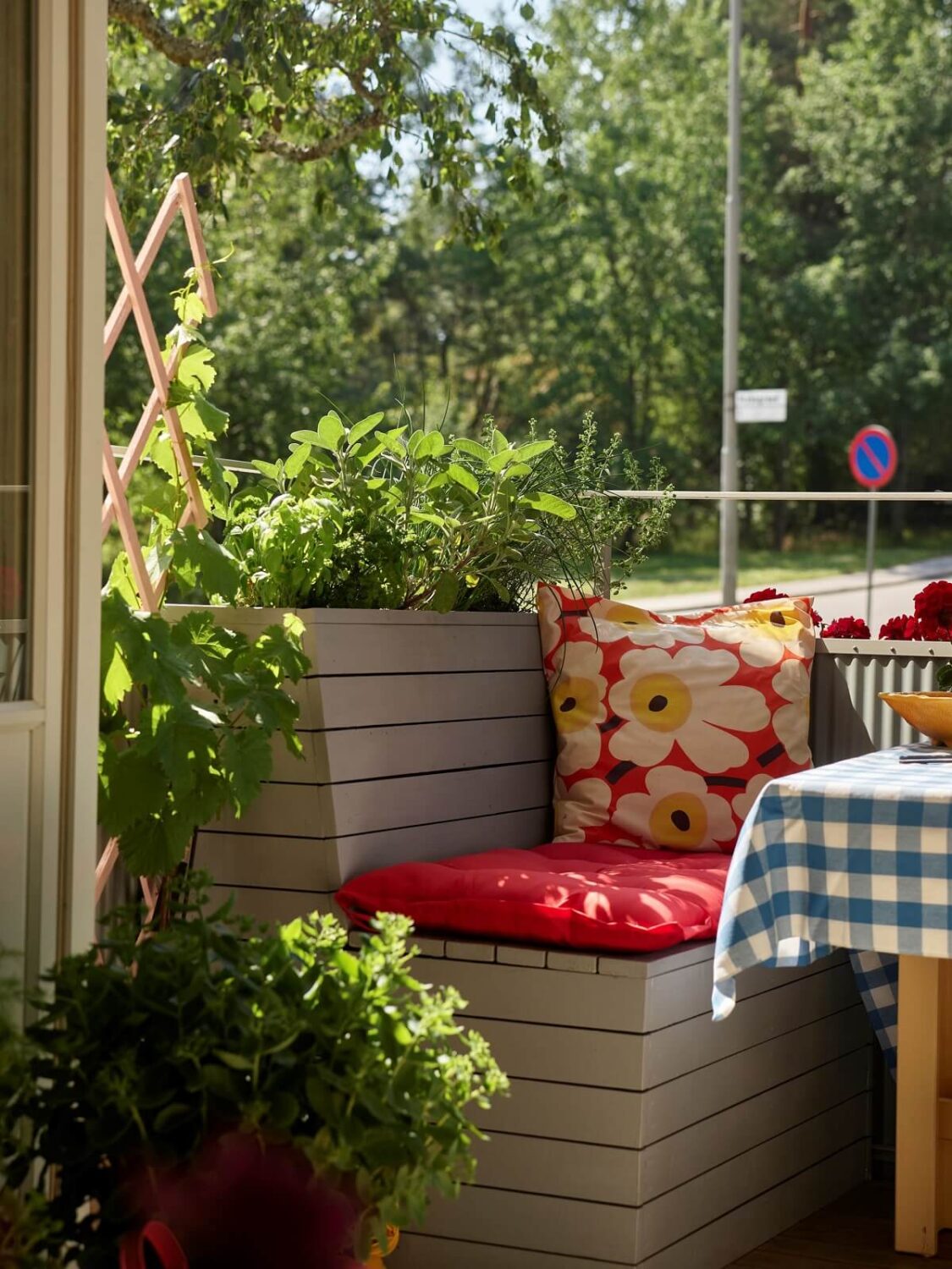 A Colorful Swedish Apartment Inspired by the 50s and 70s 10 built in seating balcony