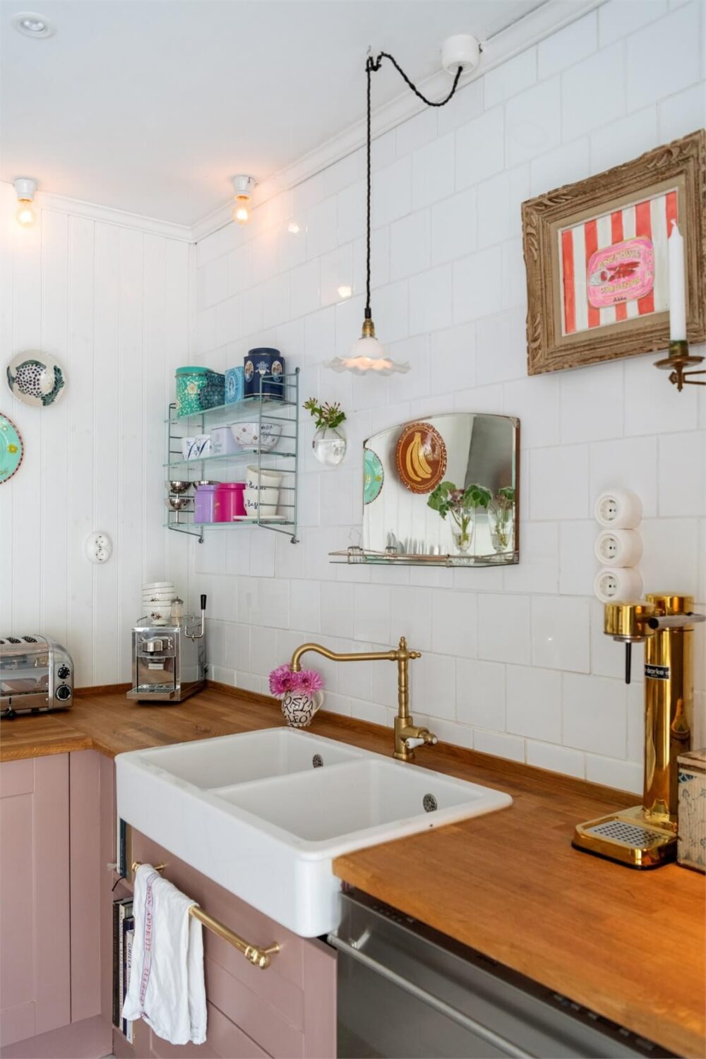 A Bright Open-Plan Swedish Home with a Pink Kitchen 12 butler sink in pink kitchen